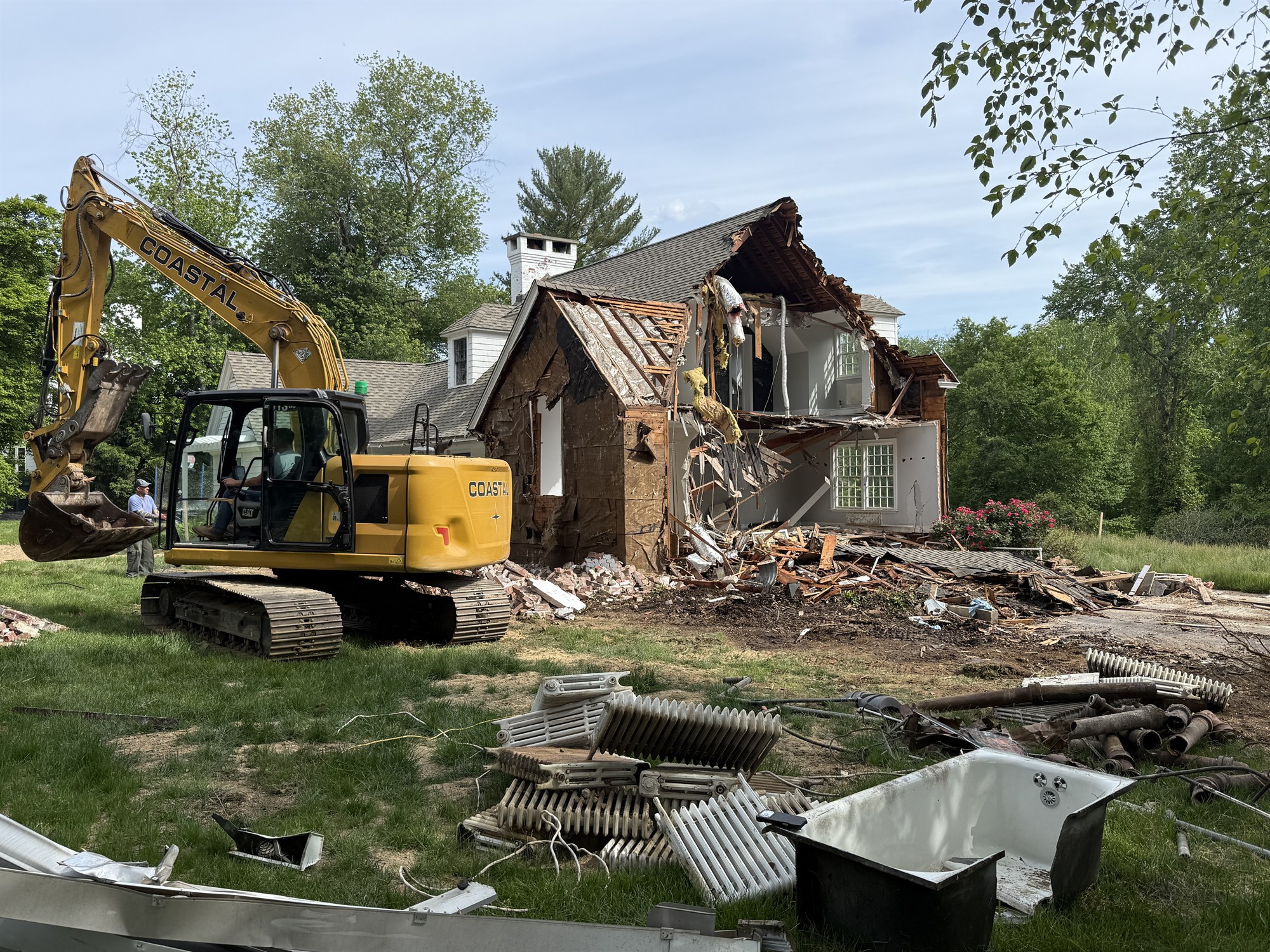 CLH excavator demolishing a house in Connecticut